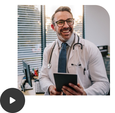 A doctor is holding a tablet and happy because he got answers to his medical questions.